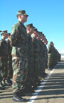 U.S. Marines and Army soldiers stand in formation with the Georgian Army forces during the Feb. 1, 2003 opening ceremony of Phase IIIB of the Georgia Train and Equip Program.