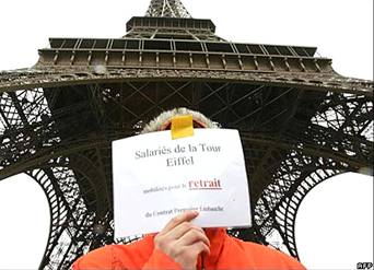Employee outside the closed Eiffel Tower