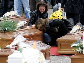 Women react at the funerals for quake victims in L'Aquila, central ...
