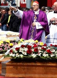 Cardinal Tarcisio Bertone blesses coffins during the funerals ...