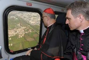 Vatican State Secretary Italian Cardinal Tarcisio Bertone (L) ...