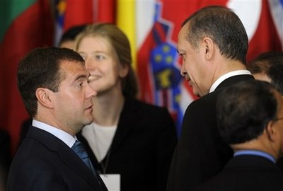 Russian President Dmitry Medvedev, left, greets Turkish Prime ...